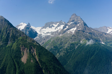 Northern great caucasus mountains near dombay with glaciers and snow in august 2019, original raw picture