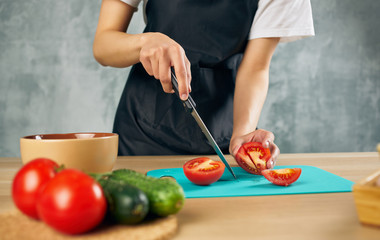woman cutting vegetables in the kitchen
