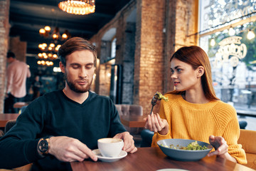 young couple having dinner in restaurant
