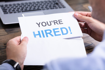 Man Reading You Are Hired Mail