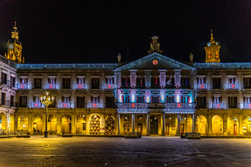 Plaza Nueva (or Plaza de Espana) and city hall illuminated for Christmas, Vitoria Gasteiz, Alava,...