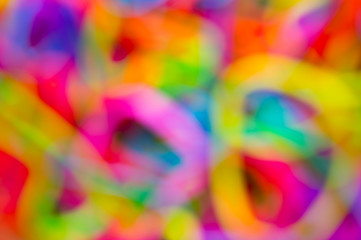 Bright defocussed abstract background of jumble of rainbow colors