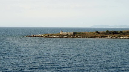 Rocky shore. View of rocky mountain from the Mediterranean sea surface. Greece. 4K