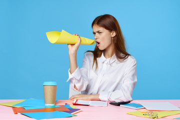 young woman painting with paint brush