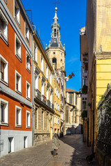 Typical pedestrian street in Vitoria-Gasteiz old town leading to San Pedro church, Basque Country, Spain