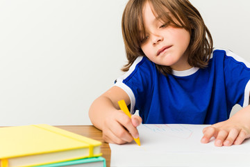 Little caucasian boy drawing