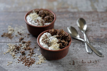 Keto diet. Greek yogurt with flax seeds, sesame seeds and chocolate crunches. Keto friendly breakfast or dessert.
