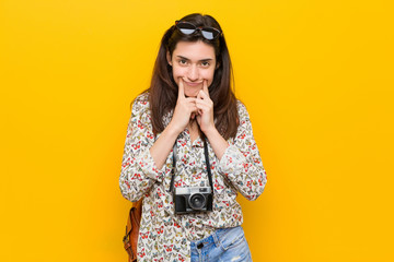 Young brunette traveler woman doubting between two options.