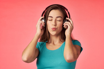 young woman listening to music with headphones