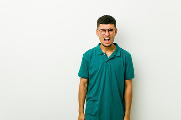 Fototapeta premium Young hispanic man screaming very angry and aggressive.