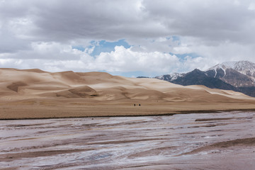 Sand dunes and river in the mountains 