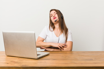 Young telemarketer woman tired of a repetitive task.