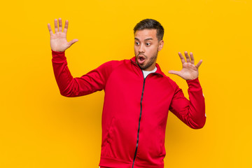 Young filipino fitness man being shocked due to an imminent danger