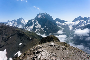 Northern great caucasus mountains near dombay with glaciers and snow in august 2019, original raw picture