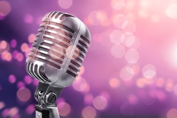 Retro style microphone on bokeh background