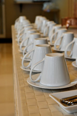 Close up empty glasses set and spoon in plate on table in restaurant.