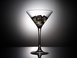 empty martini glass on black background