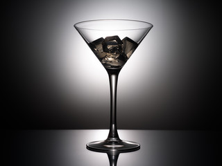 empty martini glass on black background