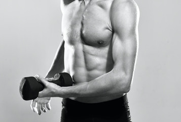 Naklejka premium muscular man with dumbbells