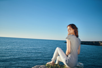 Fototapeta na wymiar woman meditating on the beach