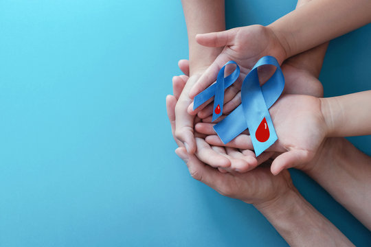 Light blue ribbons with blood on blue background , world diabetes day