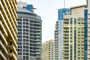 Close-up view of some modern buildings and skyscrapers in Dubai. Dubai is the largest city in the United Arab Emirates (UAE) and the capital of the Emirate of Dubai.