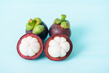 Fresh mangosteen fruit on pastel background