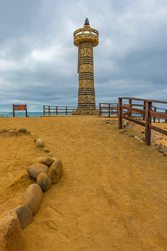 Vertical photograph of the lighthouse by Santa Elena Cape in Ecuador near Salinas city, marking the most western point of the country into the Pacific Ocean. The area is known as La Chocolatera.