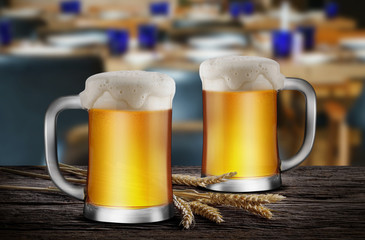 Two Glasses of Light Beer with wheat on the wooden table in the restaurant, with copy space for your text