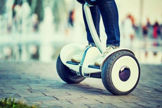 Human Legs And Feet On Hoverboard  Park Paths