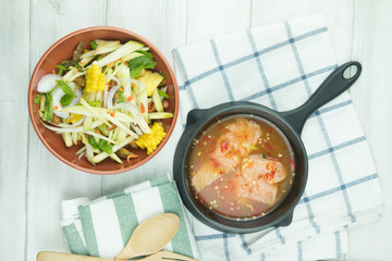 Spicy slice mango salad served with salmon