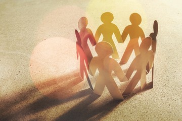 Circle of paper people on white background