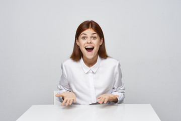 business woman sitting at desk with laptop