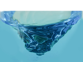 blue glass bowl of water