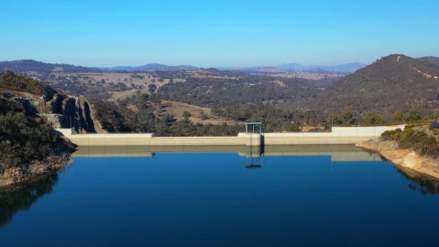 Aerial view of Cotter Dam, a concrete gravity and embankment dam across the Cotter River, located in Canberra, the capital of Australia     