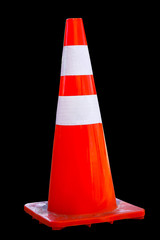 Orange and white traffic cone isolated on black background.