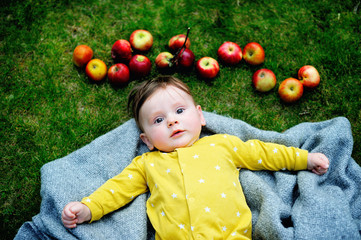 infant boy with apples