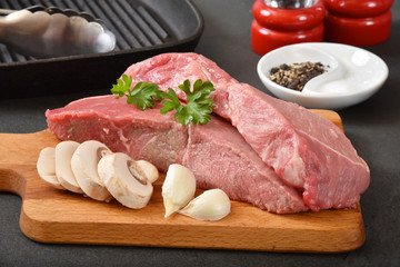 Thick raw sirloin steaks
