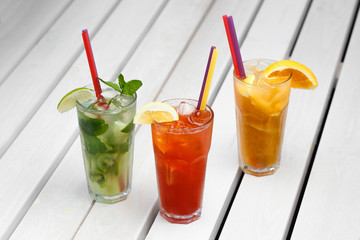 glasses with different colored drinks