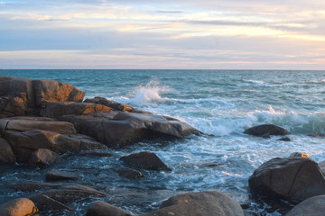  At the beach During the setting sun The wind blows cool. Beautiful clouds and rocks with sandy ground