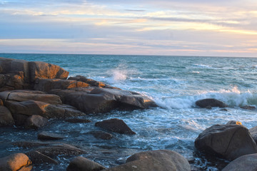  At the beach During the setting sun The wind blows cool. Beautiful clouds and rocks with sandy ground
