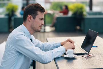 businessman working on tablet computer in office