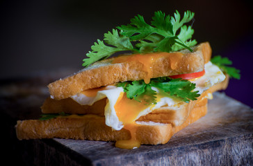 The cup sandwich bread is on the table.