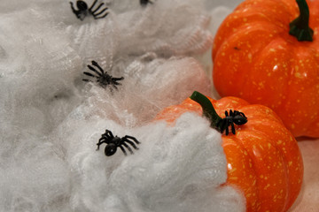 orange artificial spider web with spiders
