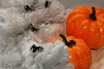 orange artificial spider web with spiders