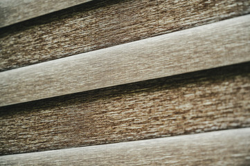 Vintage filter used on photo of two fabric light filtering shades in closed position 