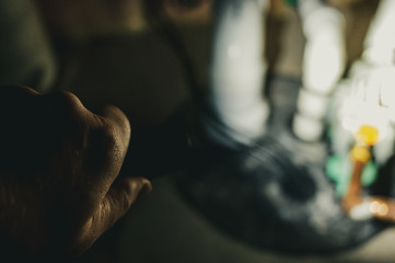 flashlight shining light on sump pump system