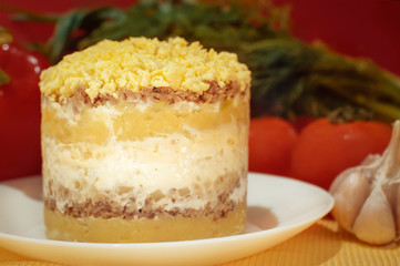 Themed holiday salad Mimosa with Cheese Mouse in honor of the 2020 new year on the Chinese calendar. Eastern horoscope. Traditional Russian holiday food - Mimoza. Selective focus.