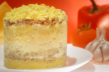 Themed holiday salad Mimosa with Cheese Mouse in honor of the 2020 new year on the Chinese calendar. Eastern horoscope. Traditional Russian holiday food - Mimoza. Selective focus.