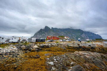 Parking in a small town in the Lofoten Islands The sky is cloudy like it is about to rain. Henningsvaer, Norway